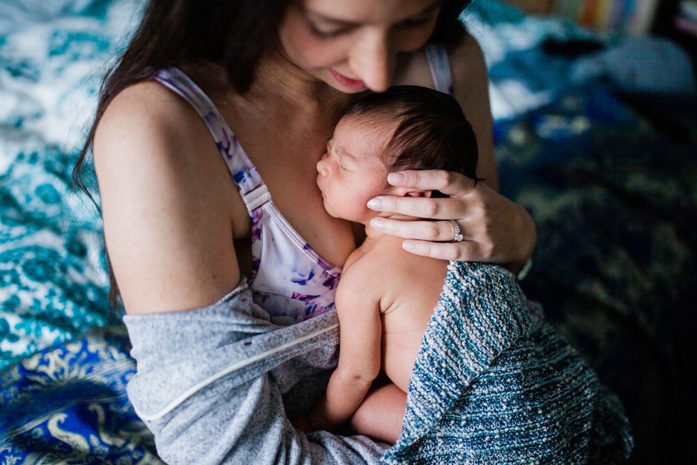 Intimate family moments in soft natural light — newborn mini session